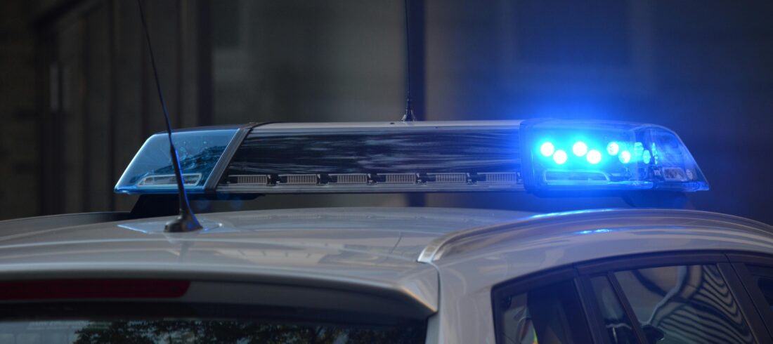 Police car at the scene of a car accident, representing law enforcement response in auto accident cases handled by Giddings Law Group in Brandon and Hillsborough County, Florida.