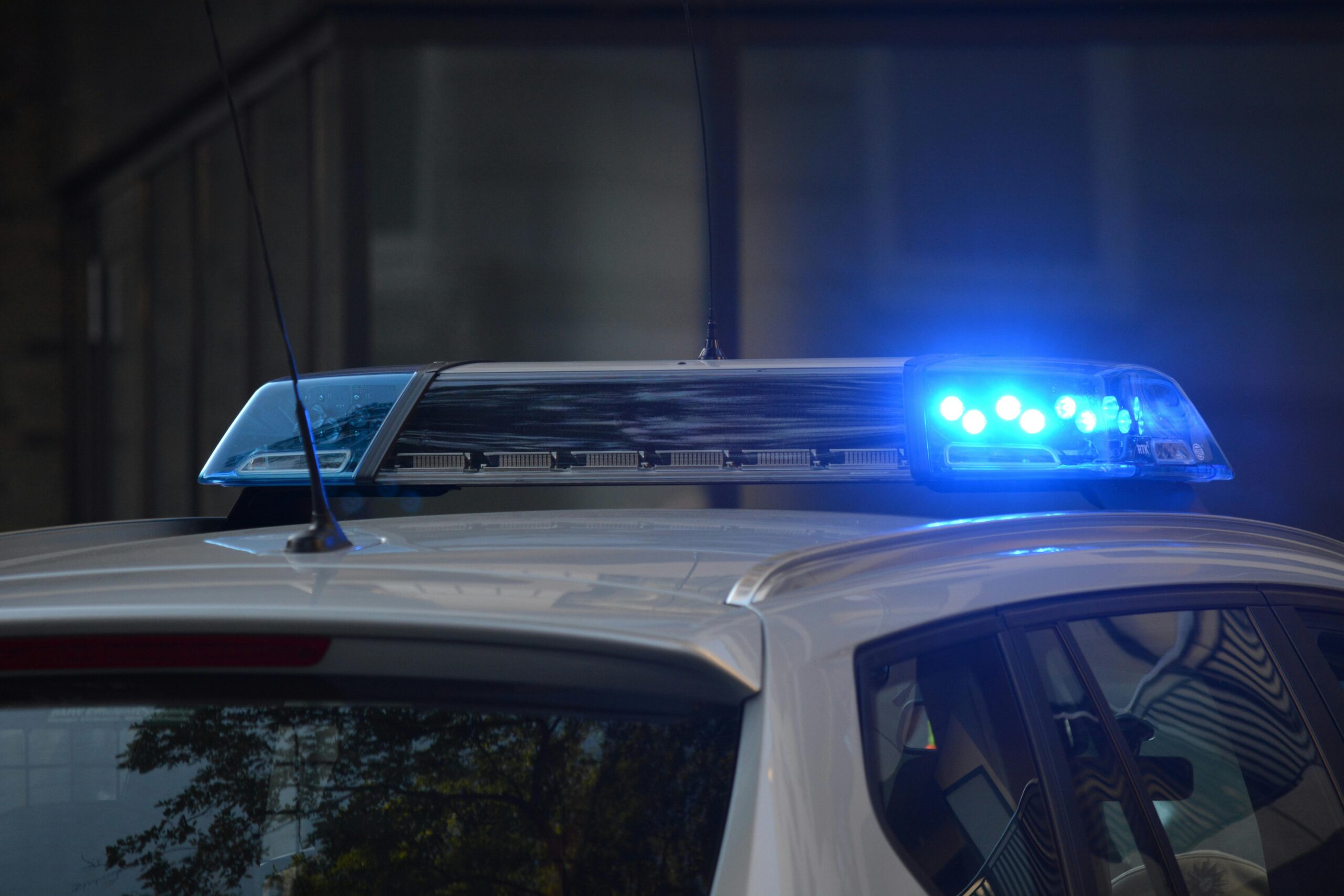 Police car at the scene of a car accident, representing law enforcement response in auto accident cases handled by Giddings Law Group in Brandon and Hillsborough County, Florida.